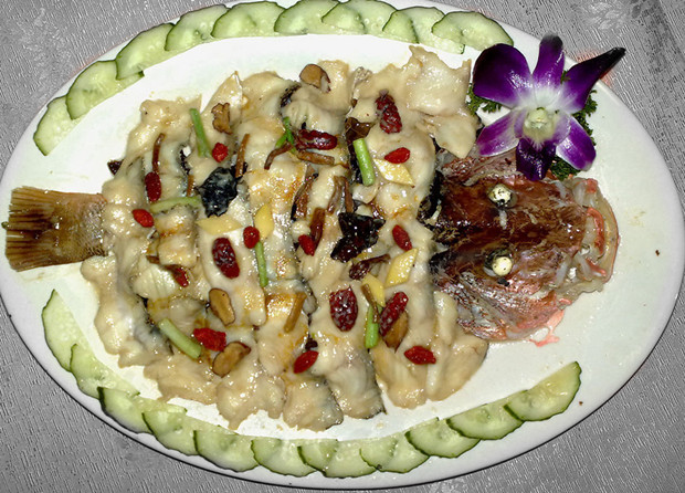 Steamed fish with ginger, green onion and clam dressing